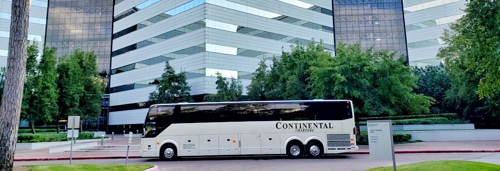 HP Business Building Office With Large Continental Charters Bus Parked In Front.